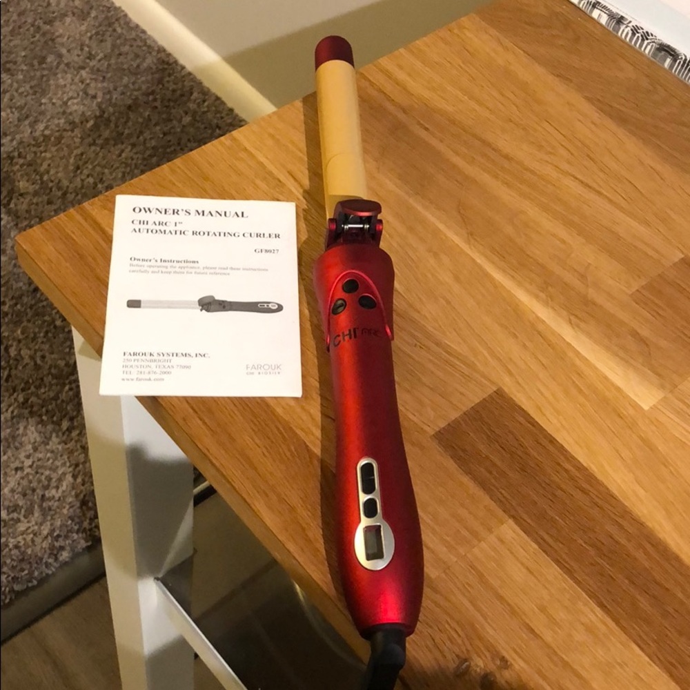 BRAND new Chi ARC rotating curling iron